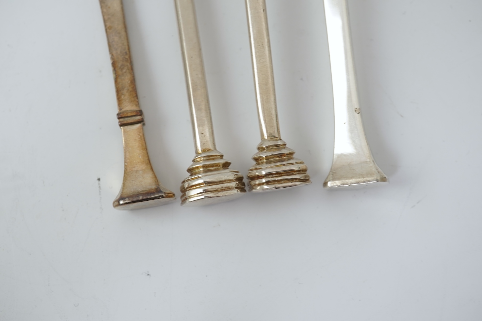 A pair of Elizabeth II silver 'seal top' spoons by The Guild of Handicrafts, London, 1990, 16cm, together with a similar later spoon, London, 2008 and a similar preserve spoon, London, 2003, two with boxes.